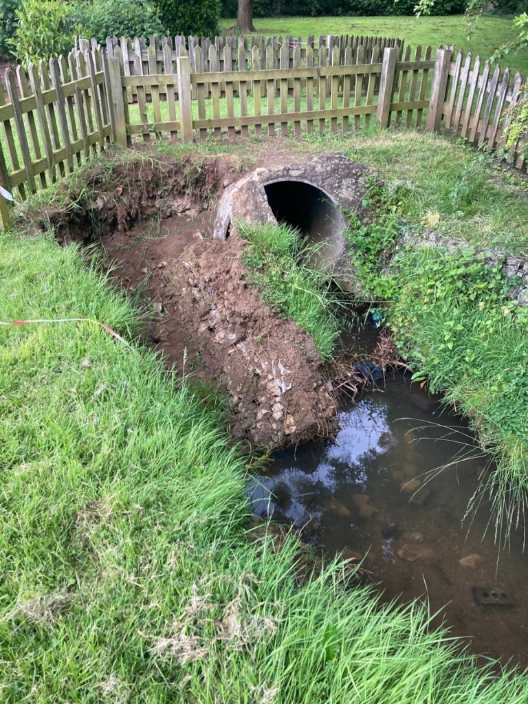 Collapsed stream bank in Birdie Close, Kibworth, Leicestershire